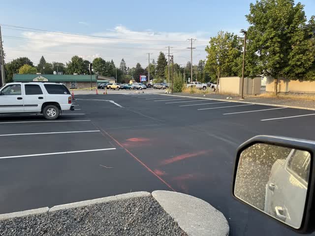 Freshly striped parking stalls on new asphalt